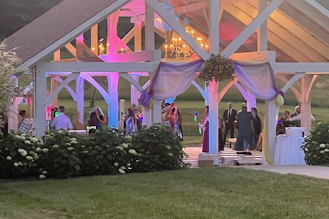 olorful reception lighting under the pavilion during a wedding at Morning Glory Wedding Venue